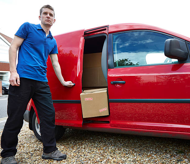 istock Careless delivery man shuts package in door 519488961