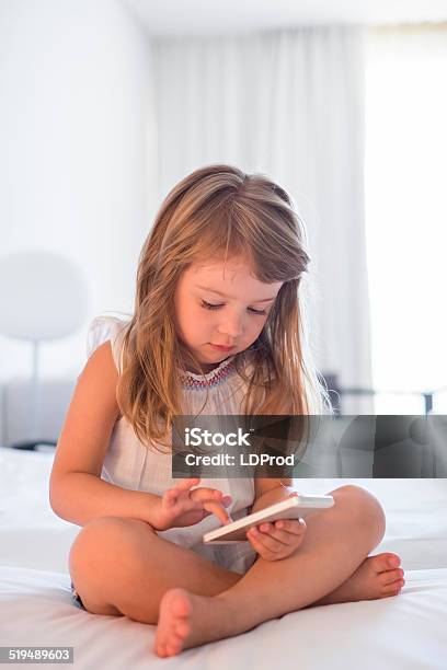 Child Using Mobile Phone At Home Stock Photo - Download Image Now - Baby - Human Age, Baby Girls, Beautiful People