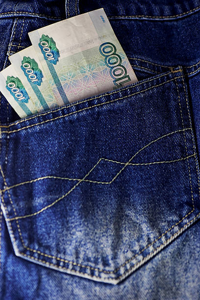 istock Russian rubles stick out of a hip-pocket jeans 519490708