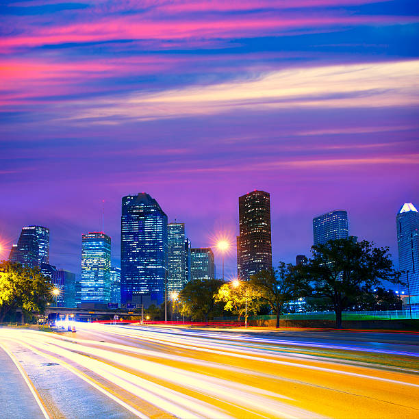istock Houston Texas skyline at sunset with traffic lights 519490781