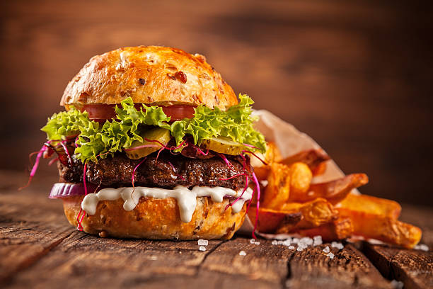 istock Fresh home-made hamburger served on wood 519490810