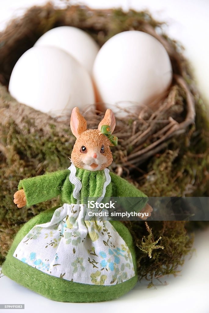 Easter rabbit ester rabbit toy with white eggs in nest Animal Nest Stock Photo