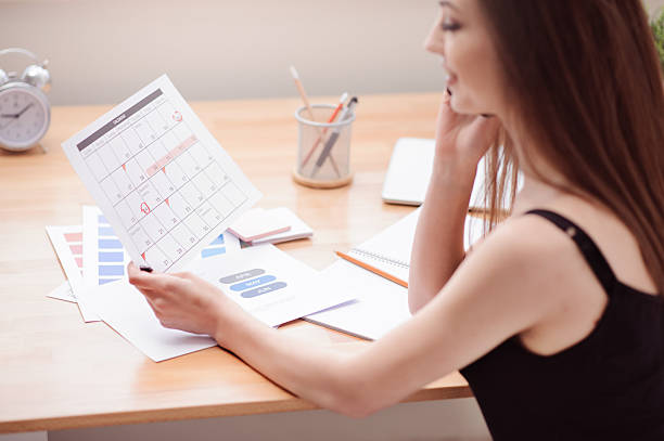 istock Cheerful girl sitting at the table 519491504