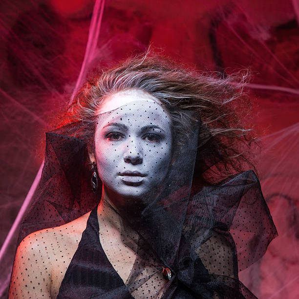istock Halloween concept with young witch woman 519492513