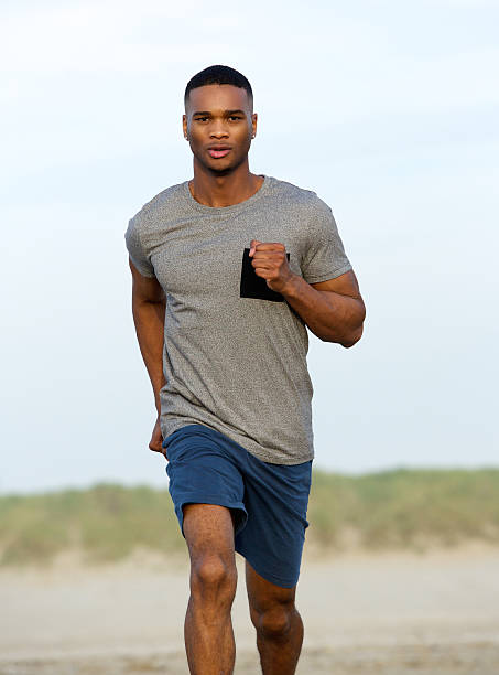 istock Healthy young black man running outdoors 519492645