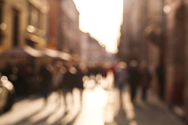 istock Blurred background people in town square at sunset 519492666