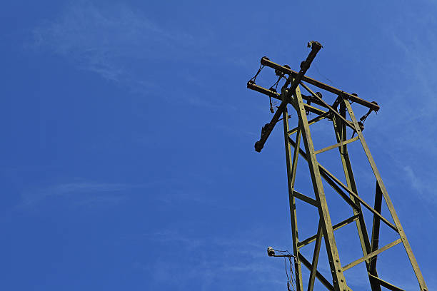 istock Unused electric tower on blue sky background 519493092