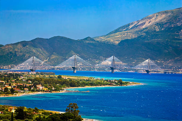 Rio-Antirrio Bridge Greece. Gulf of Corinth and the Rio-Antirrio Bridge, a cable-stayed bridge linking the town of Antirrio (mainland Greece, foreground) to Rio (Peloponnese peninsula, in background) gulf of corinth stock pictures, royalty-free photos & images