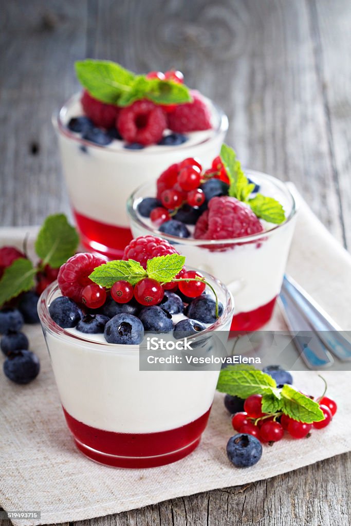 Yogurt dessert with jelly and fresh berries Yogurt dessert with red currant jelly and fresh berries Berry Stock Photo