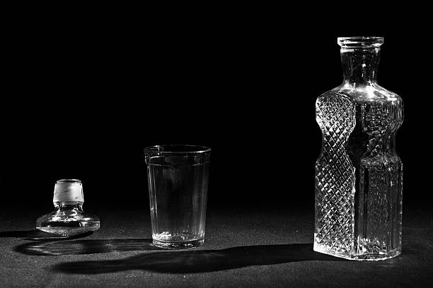 istock Bottle and glass on the black background 519495696