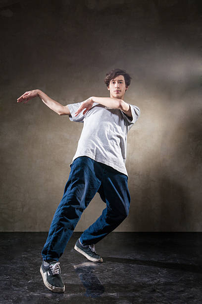 istock urban hip hop dancer over grunge concrete wall 519496384