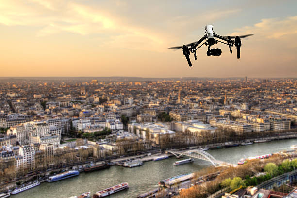 istock Drone flying above Paris city panorama 519496860