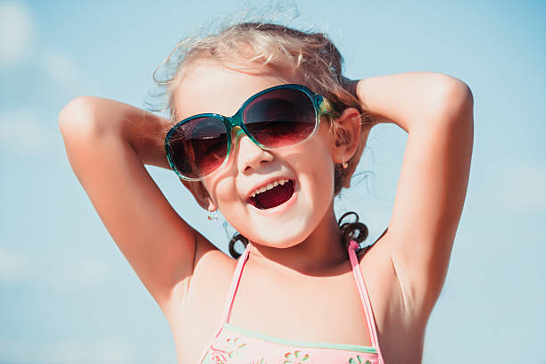 istock joyful little girl with sunglasses 519500764