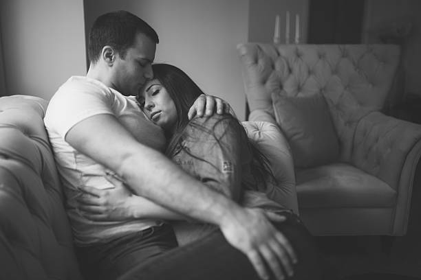 istock Affectionate couple enjoying by the window with eyes closed 519500820