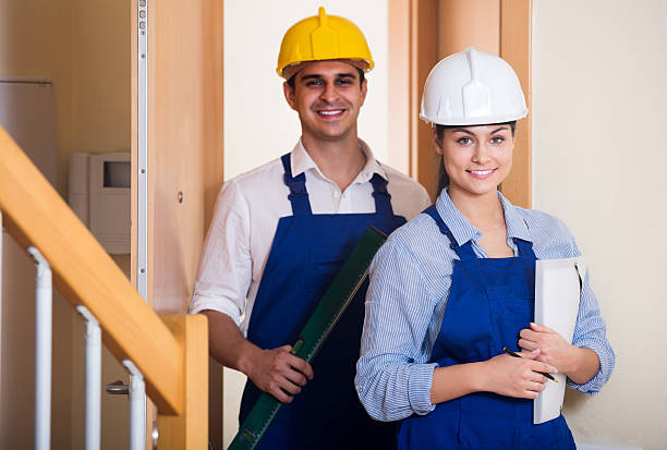 istock Professional maintenance crew of two specialists indoors 519501128