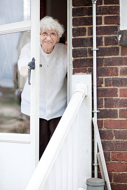 Senior Woman Looking Out Door