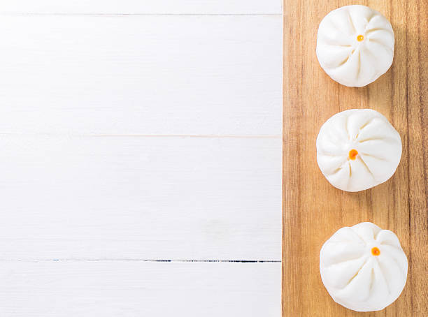 Salapao Chinese Bun on wooden tray Top view