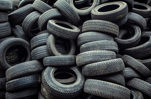 used car tires pile in the tire repair shop yard