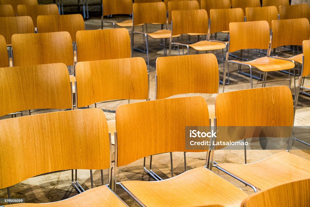 Group of chairs with no people inside a church Field of chairs inside a gothic church. Arranging Stock Photo