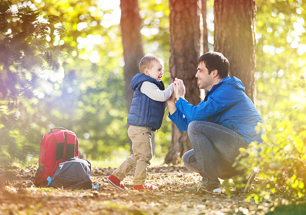 istock Father and son in the forest 519505493