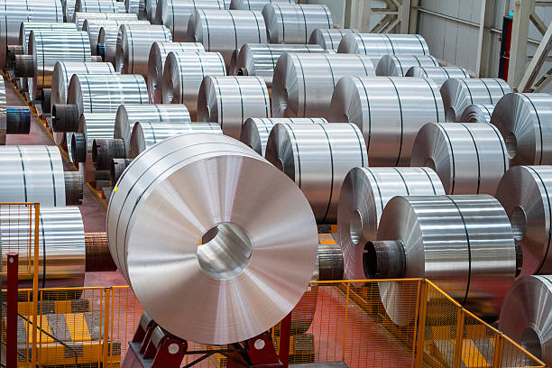 Large Aluminum Steel Rolls in the factory Large Aluminum Steel Rolls in the factory. Image taken in daylight with a Sony A7Rii (42 megapixels) and developed from raw.. This pictures were taken in Asas Aluminum Factory in Adapazari Turkey with a special permission together with property release sheet metal photos stock pictures, royalty-free photos & images