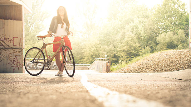 Girl With A Bicycle Stock Photo - Download Image Now - Adult, Adults Only,  Bamboo - Material - iStock