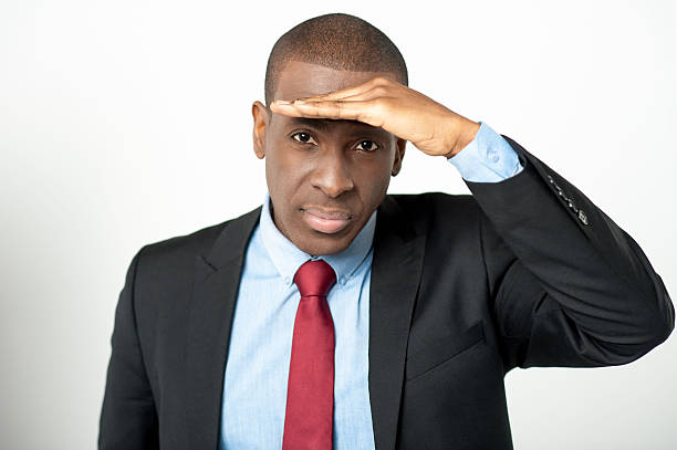 istock Businessman observing something closely 519507951