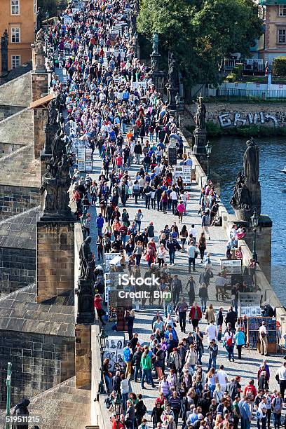 Crowd Of Tourists On Charles Bridge Over Vltava River Prague Stock Photo - Download Image Now