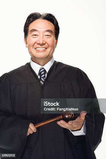 Lawyer Holding Gavel Smiling Portrait Stock Photo - Download Image Now - Judge - Law, Portrait, Judge's Robe