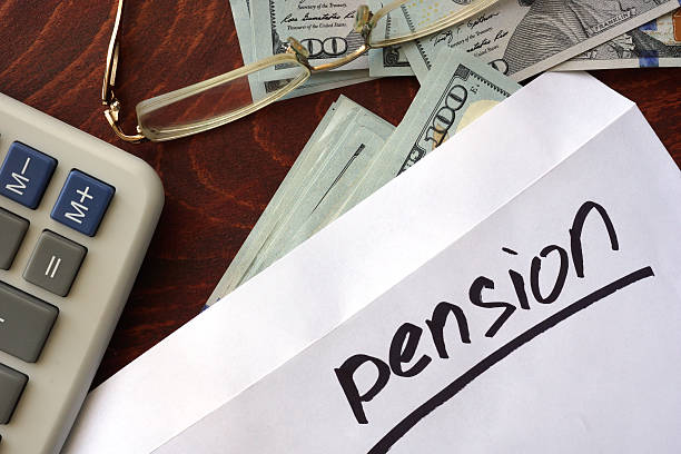 istock Pension written on an envelope with dollars. 519518468