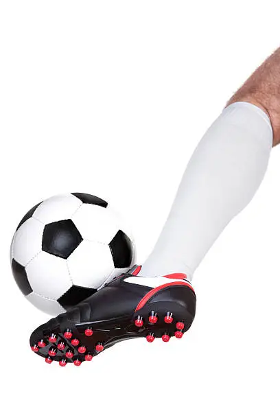 Photo of Soccer player kicking the ball