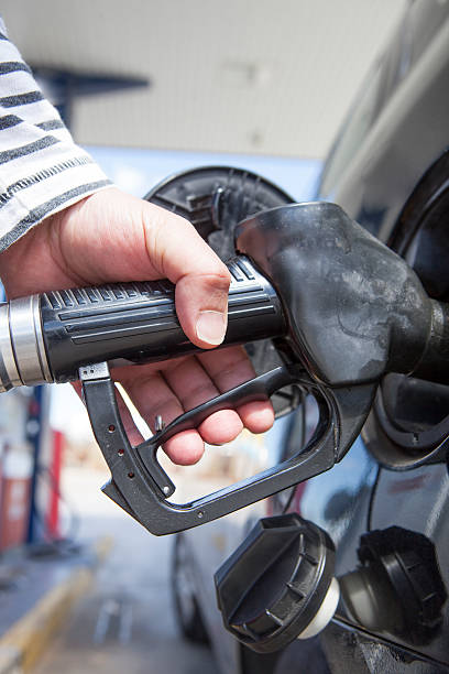 istock Man pumping gasoline fuel in car 519521582