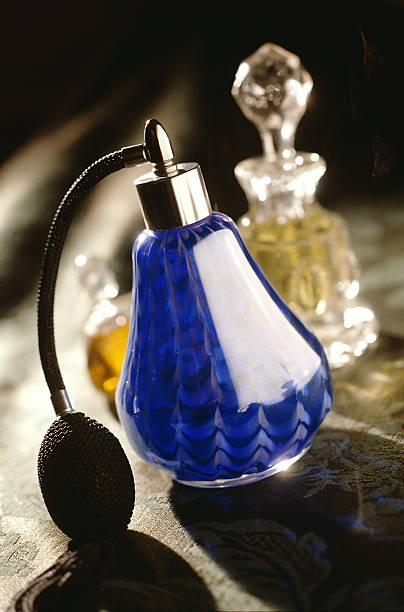 istock Elegant bottle of perfume on the table 519523426