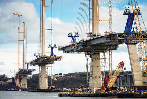 Construction in progress of the new bridge over the Firth of Forth, between Fife and the Lothians.