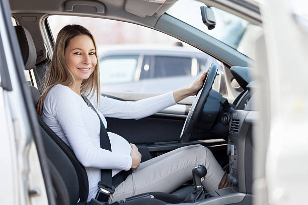 istock Pregnant woman driving her car 519524568