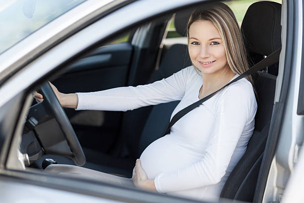 istock Pregnant woman driving her car 519524710