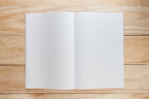 istock Blank paper or book mock up on wood background 519525056
