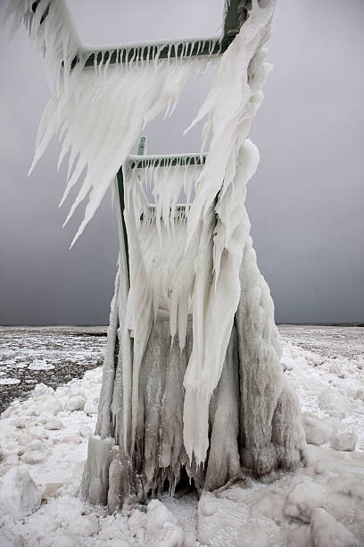 istock Ice encrusted pier and walkway on Lake Michigan. 519526112