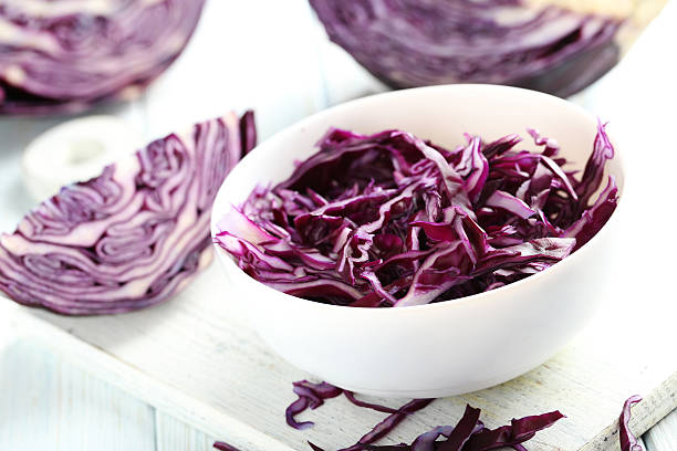 istock Ripe red cabbage on a blue wooden table 519526420