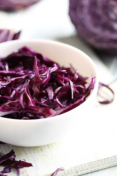 istock Ripe red cabbage on a blue wooden table 519526464