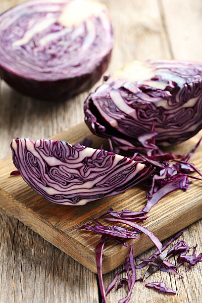 istock Ripe red cabbage on a grey wooden table 519526604
