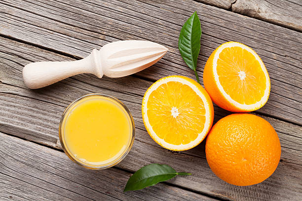 istock Fresh ripe oranges and juice 519527054