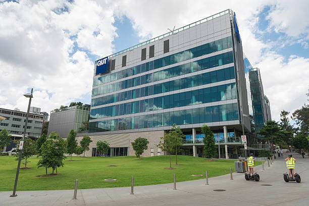 Brisbane, Australia - November 15, 2015: Color image of Queensland University of Technology building at the main campus in Brisbane. It's a weekend day, the campus is relatively empty. Some people are going to the botanical gardens which is next to QUT. QUT is a research university based in Brisbane.