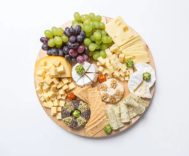 Cheese plate variation on white background.
