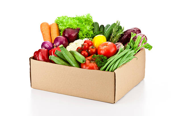 istock Crate filled with assortment of organic vegetables on white backdrop 519528862