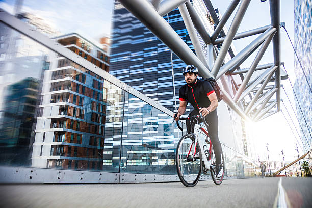 Commuter cycling fast at work in the morning