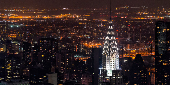 Manhattan at night, beautifully illuminated, highlighting the Chrysler Building. Picture taken from the observatory of the Empire State Building in October, 2013.
