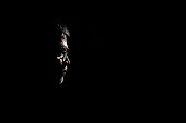 Portrait of a senior man in dark background.