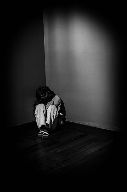 Leave me alone A little boy cowering in fear in the corner of a room, in black and white kidnapping photos stock pictures, royalty-free photos & images