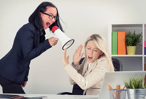 istock Boss yelling at employee on megaphone 519534955
